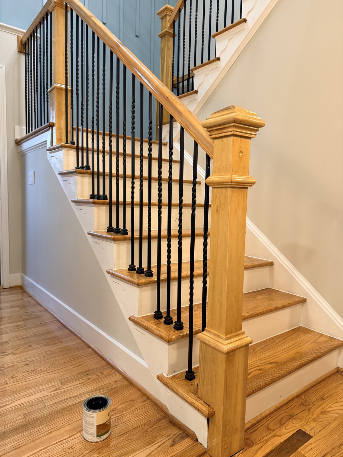 Full flight of refinished oak stairs with newel post and handrail