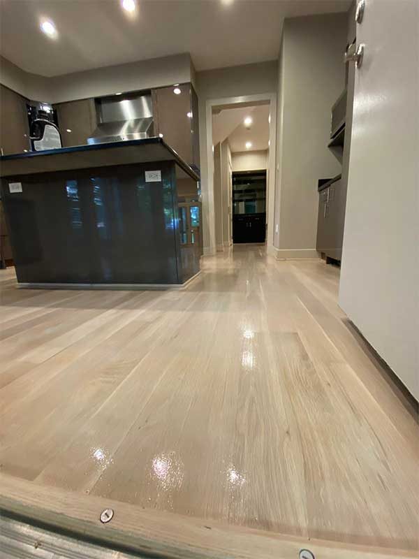 Refinished hardwood floor in an open floor plan in Bethesda, MD