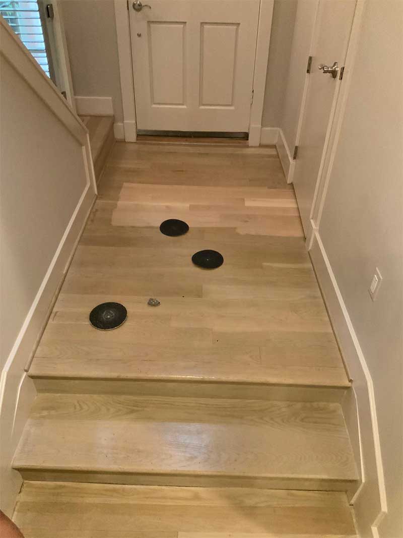Staircase with sanded treads during refinishing in Bethesda, MD