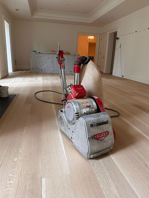 Dustless floor sander on a newly sanded hardwood floor