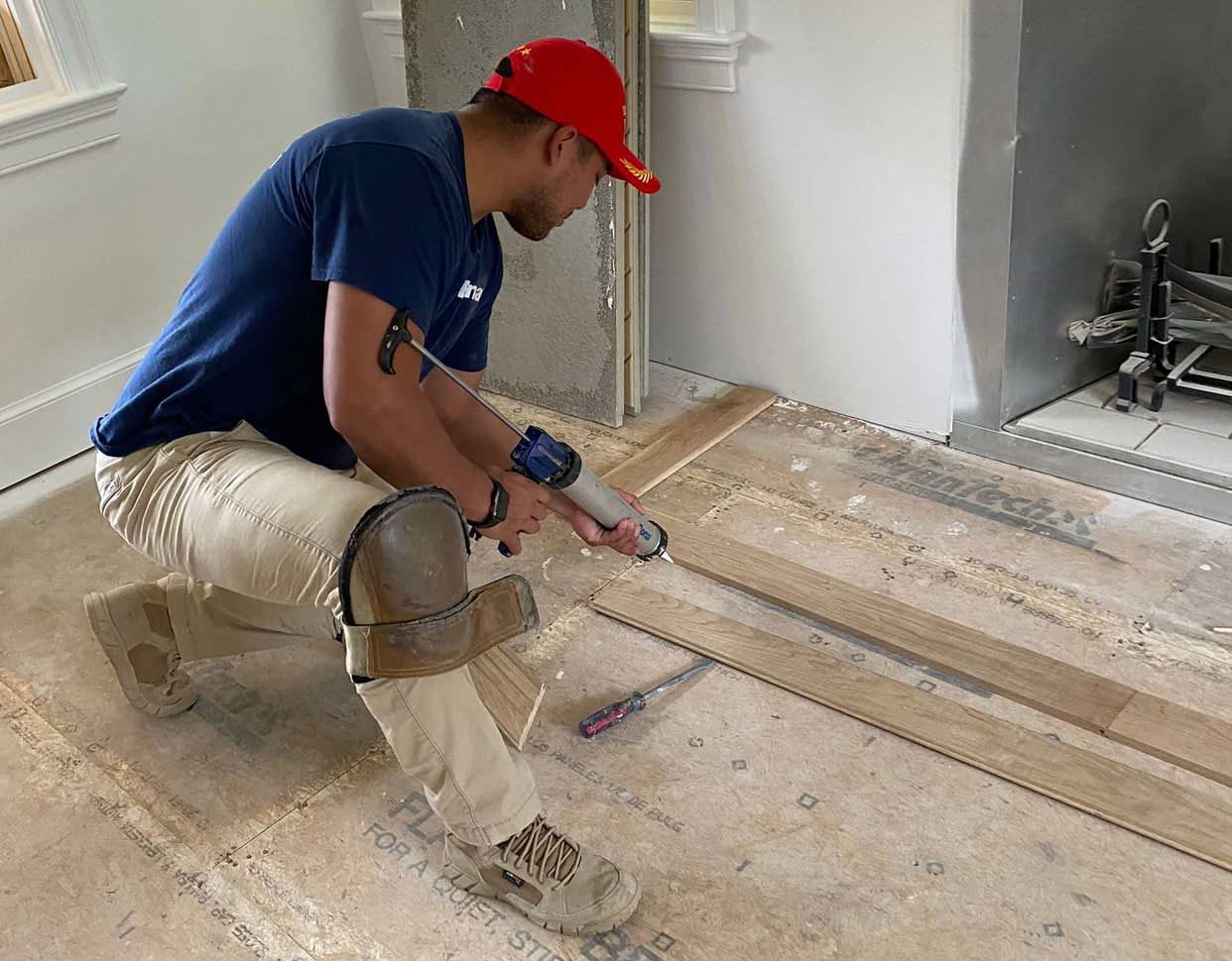 Erlin installing hardwood flooring
