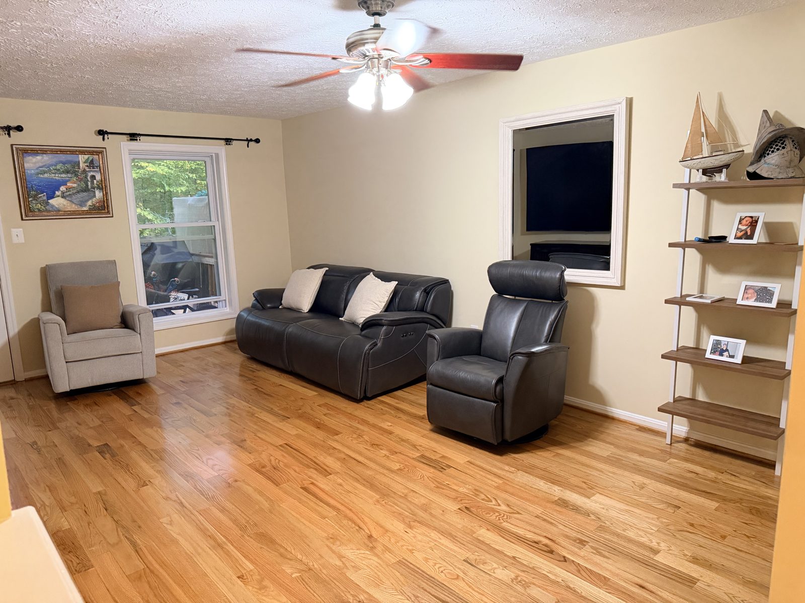 Glossy refinished red oak hardwood floor in a Germantown, Maryland living room