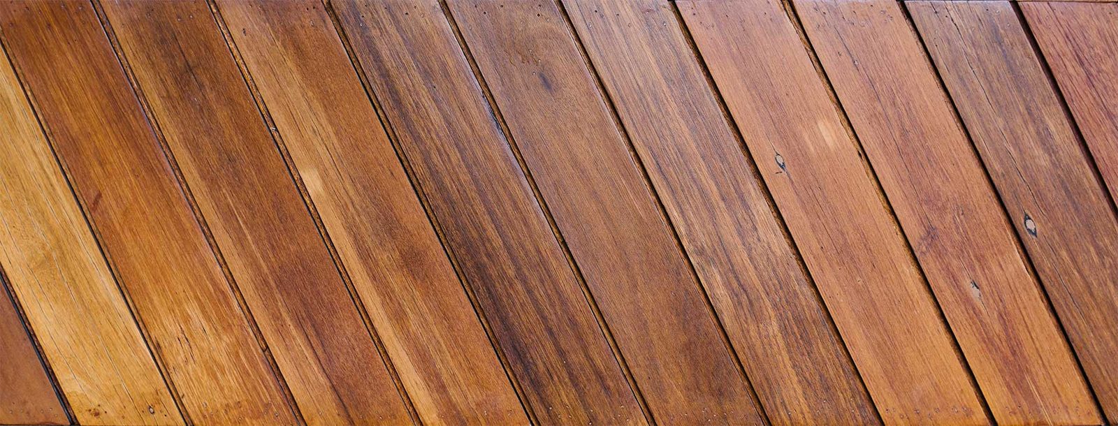 Close-up of diagonal hardwood flooring planks showing the wood grain