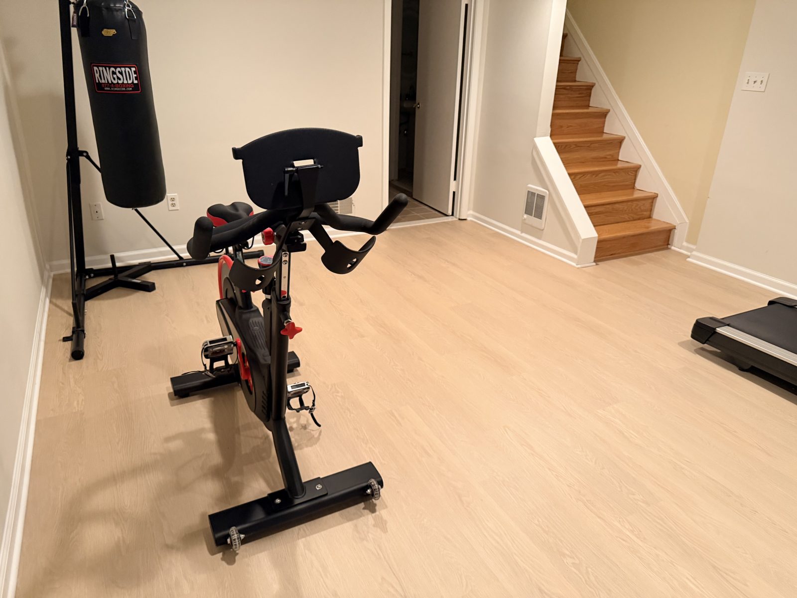 Light oak-look luxury vinyl plank flooring installed in a Germantown, MD basement