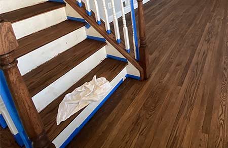 Refinished stained stair treads with white risers