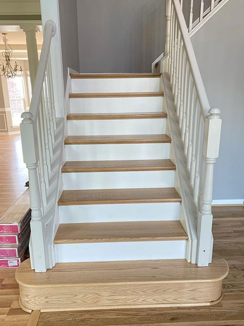 White painted stairway with refinished oak treads
